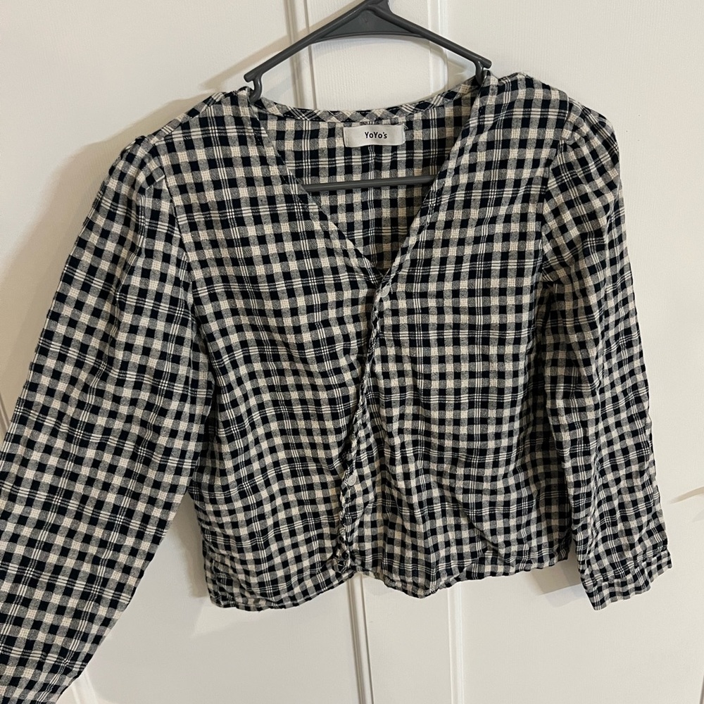 Dark blue plaid top with asymmetrical, button-up v-neckline